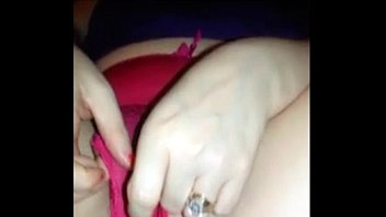 sexy wife rubs her pussy through her panties.
