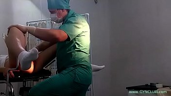 a girl in white socks on a gynecological chair