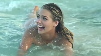 kate upton goes topless, shakes her hips in.