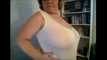mature nancy playing with her boobs on webcam.