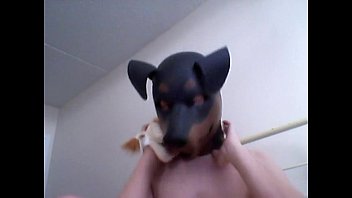kinky girl gets off wearing a rubber dog mask