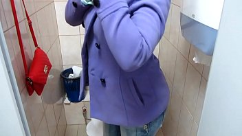 pissing in the public toilet and undressing in.