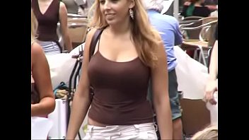 another busty blonde teen in the street, bouncing.